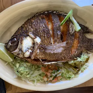 a plate of fish and vegetables