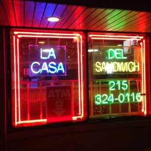 a neon sign in a window