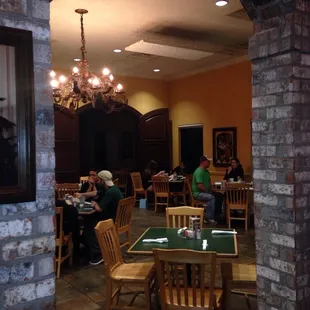 people sitting at tables in a restaurant