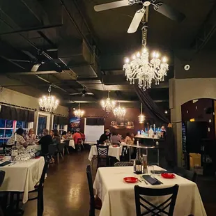 a dining room with chandeliers