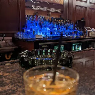 a drink in a glass on a bar