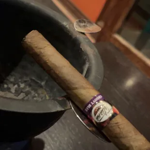 a cigar and a cigar cutter