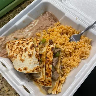 a meal in a styrofoam container