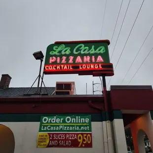 a neon sign for the restaurant