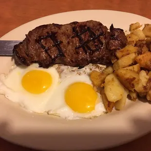 Overcooked steak, with extra runny eggs