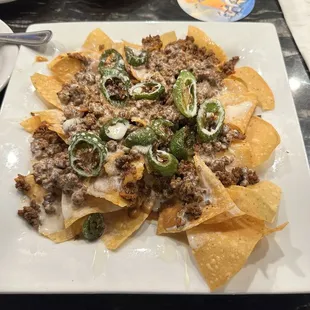 Beef and bean nachos with grilled fresh jalapeños. So much more flavor than any other Mexican restaurant around.