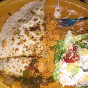 I had the vegetarian quesadilla and it was actually pretty good , I got cheese sauce and tried it with my rice and it was great.