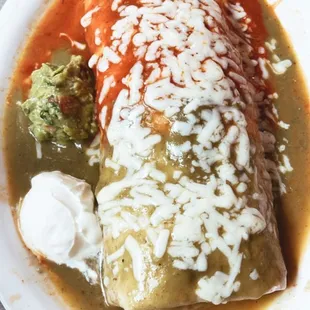 Shrimp burrito half green half red sauce