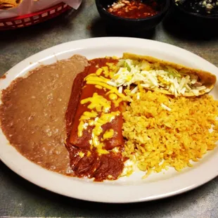 Chicken taco, enchilada, rice and beans. So delicious and hot!