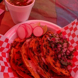 a plate of tacos and a bowl of soup