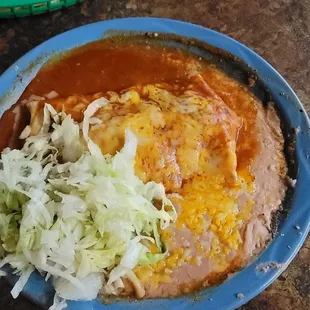 Green Chili Burro Enchilada Style with a side of beans.