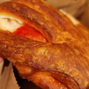 a hand holding a pastry