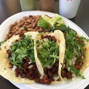 Beef fajita and pastor with a side of rice and beans