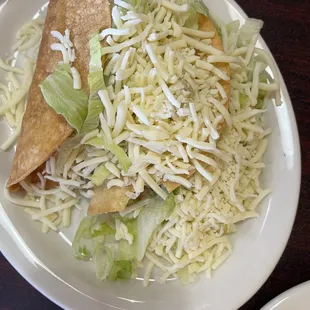 Beef and Chicken Tacos. Lots of meat and cheese.