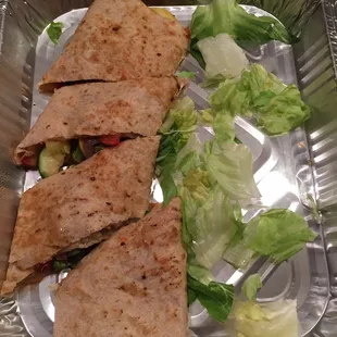 Veggie quesadilla. Would be much better with the guacamole and sour cream that we're missing from my order.