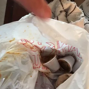 This is the mess of food we got. The bad was soaked in enchilda sauce from them not wiping and overfilling the box with the sauce.