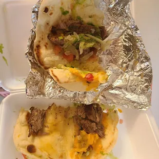 two burritos wrapped in foil