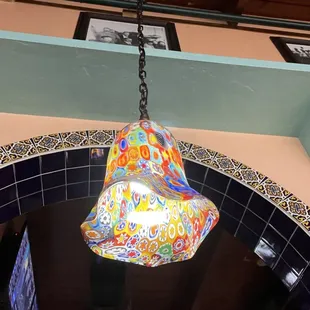 a colorful lamp hanging from the ceiling