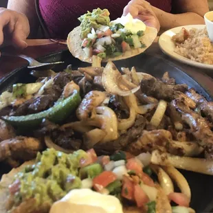 FAJITA FOR TWO. Came with rice, beans, tortillas and all the topping.