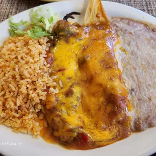 Tamale combo with beans and rice.