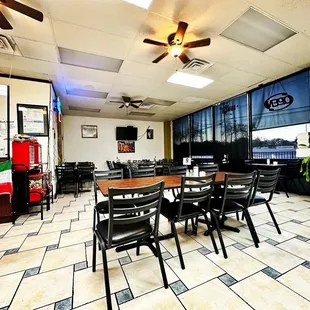 a dining room with tables and chairs
