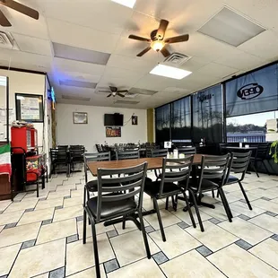 a dining room with tables and chairs