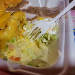 Soupy sour cream and watery lettuce, under the old guacamole all in the same compartment as the Chimichanga.