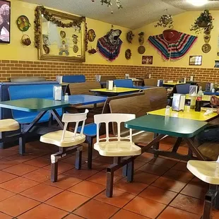 a man sitting at a table in a mexican restaurant