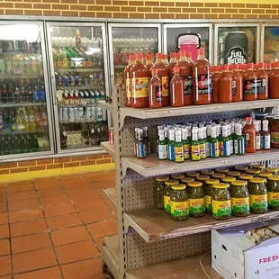 shelves of condiments and condiments in a grocery store