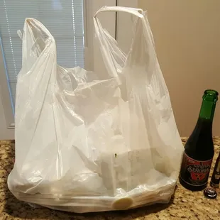 a plastic bag and a bottle