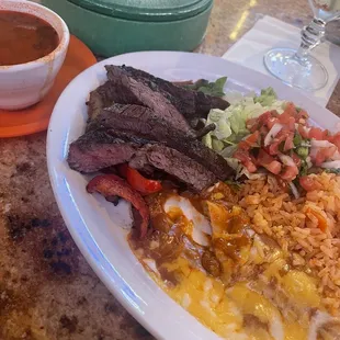 I had already taken a bite of the cheese enchilada prior to taking this photo. This was a combo plate, &quot;Guero&quot;. This meal was SO GOOOOD.