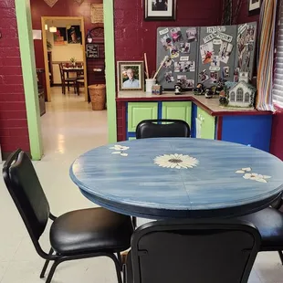 Sit at the daisy table and take in the scrapbook history wall of SCTP.