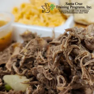 Shredded beef and cubed potatoes, served with rice, beans, tortilla, and salsa.