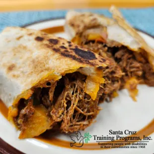 Shredded beef cooked in red chili sauce and wrapped in a flour tortilla.