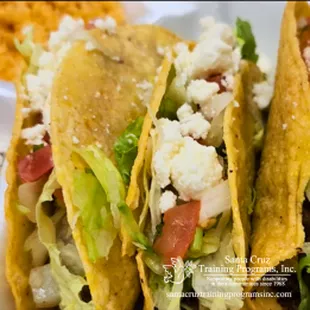 Tacos dorados are three fried corn tortilla tacos filled with beef or chicken. Comes with crumble cheese, pico de gallo, rice, beans, salsa