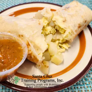 Breakfast burrito with eggs and potatoes, and wrapped in a toasted flour tortilla