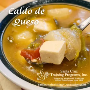 Caldo de queso is a cubed cheese soup with veggies.