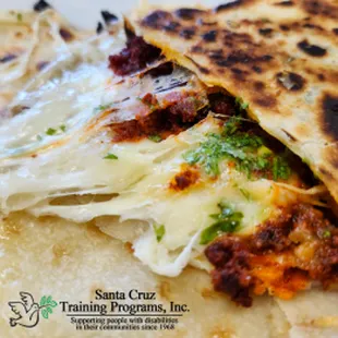 Quesadilla Especial - Two flour or corn tortilla, stuffed with chorizo mixed with red onion, cilantro, Monterrey cheese, and toasted