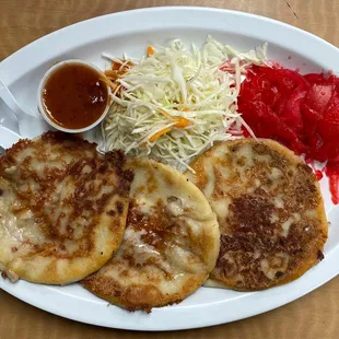 Pupusas w/ homemade refried beans and cheese ($10)