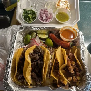 A mix of tacos: asada, barbacoa, pastor and I'm not sure but everything was