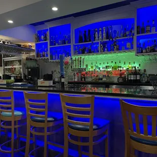 The colorful bar, with a margarita machine mixing hypnotically.