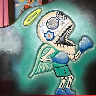 a cartoon character painted on a wall