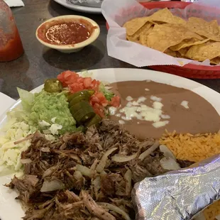 Carnitas  Very lean and flavorful. The beans are a bit bland . The jalapeño is great  Will order this again