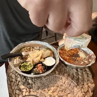 a person grabbing a piece of food