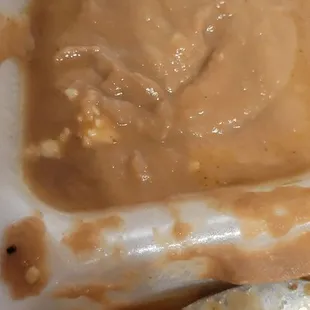 Delivered refried beans in Styrofoam container