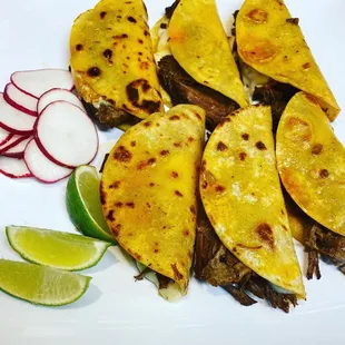 a plate of tacos and radishes