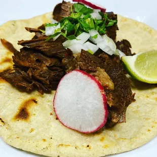 a beef taco on a tortilla