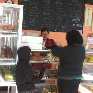 a woman serving a child