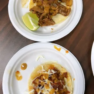 Bottom: Plain Chorizo w/ cheese taco and Top: Plain Al Pastor Taco