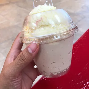 A scoop of tres leches on top and a scoop of pecan on bottom (ice cream)